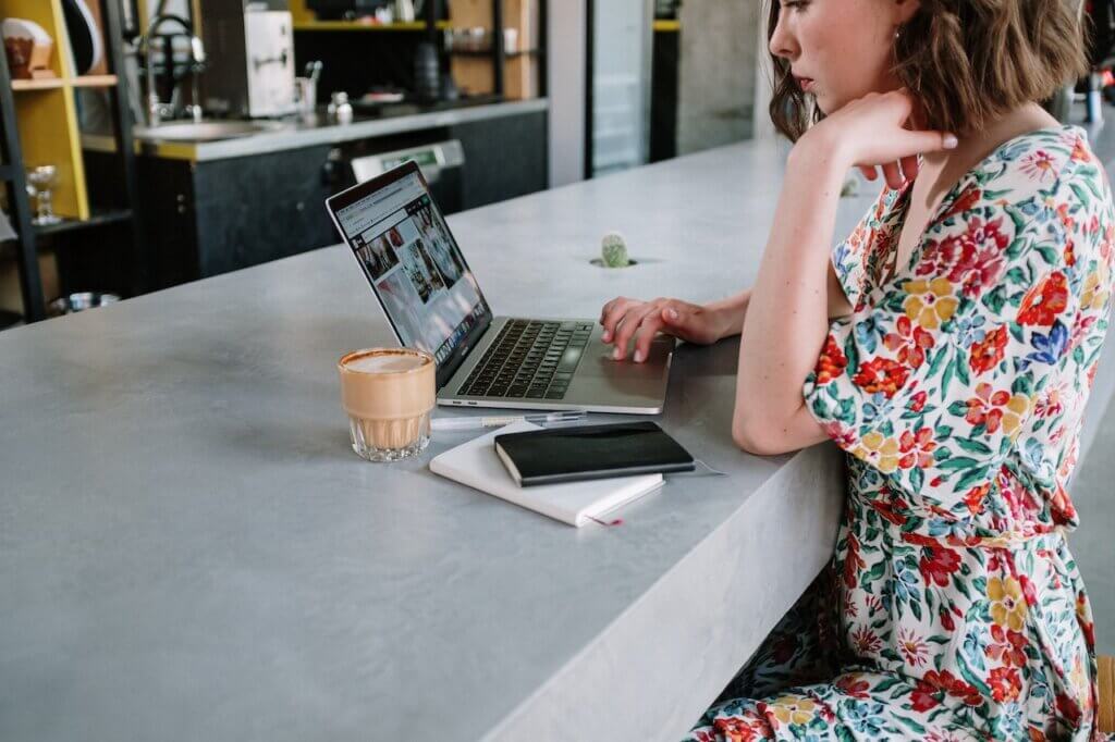 A lady with her laptop on a commercial table top