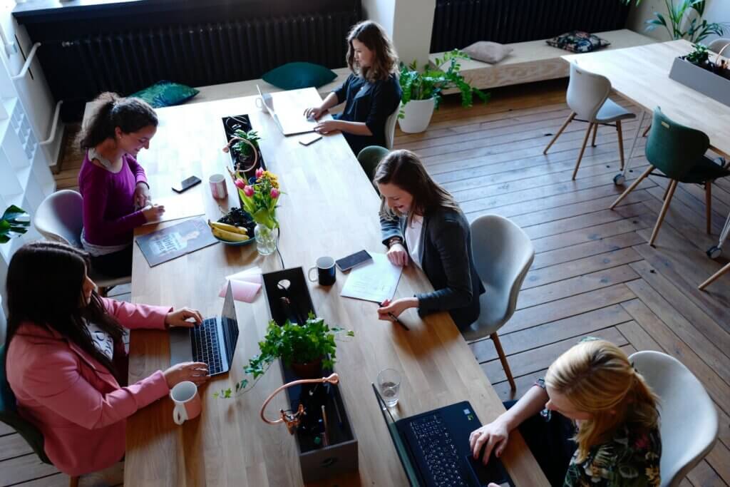 A group of women sitting and working around a table -Technical Writer, Developer Documentation is Needed at Figma