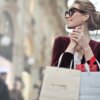A Deep Dive into Brand Perception : TheA lady on shades, carrying two shopping bags -Elon Musk, Twitter Saga
