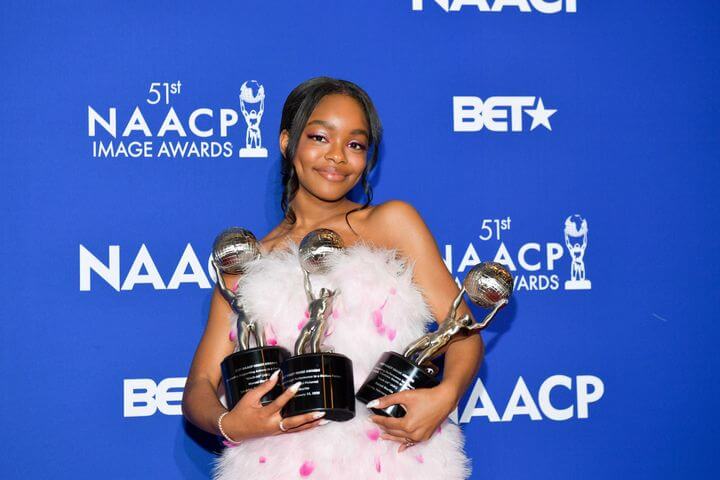 A picture of Marsai Martin holding 3 awards - Making History in 2023
