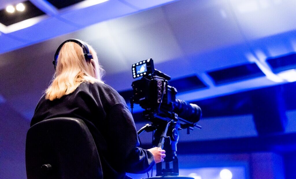 A lady behind a camera set - film festival