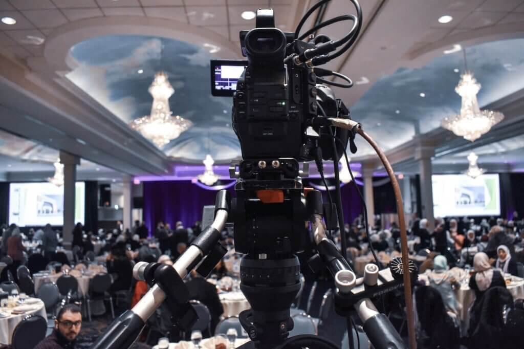 A camera covering what looks like a media fellowship